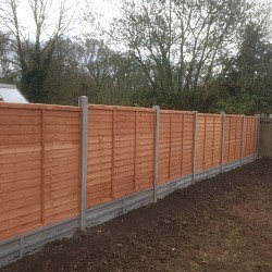 New fenceline, lap panels, concrete posts, gravel boards, new fence